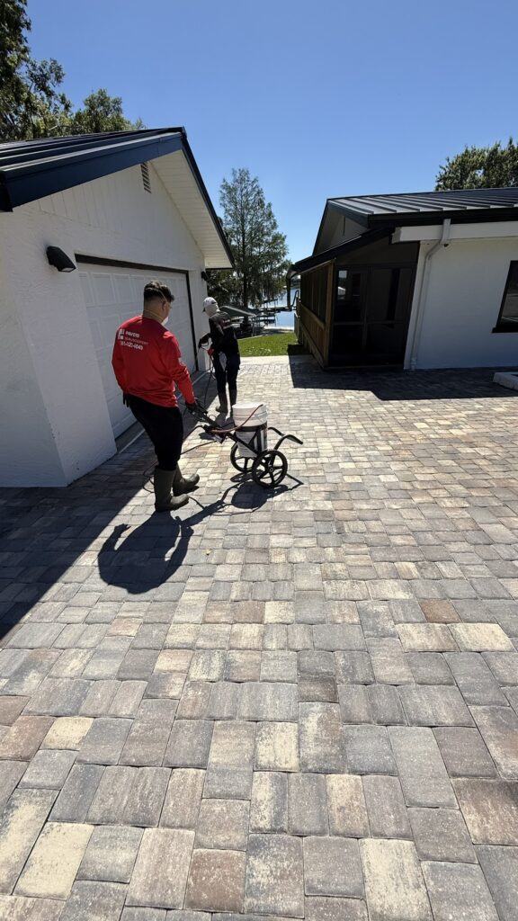Freshly sealed gray paver driveway with a rich, even finish in Miami